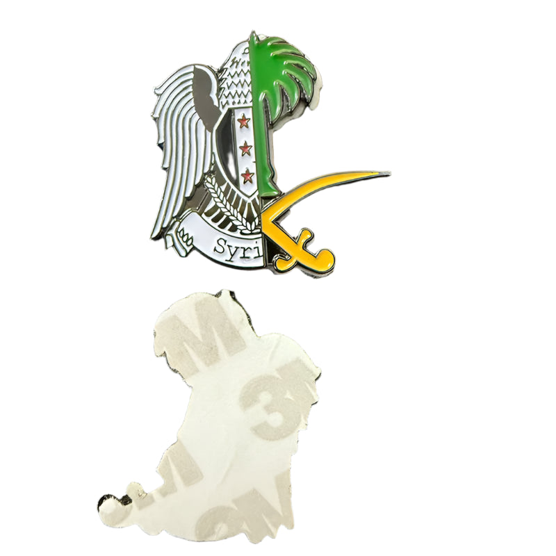 Two pins on a black background, one with an eagle design and the other with a dog silhouette.